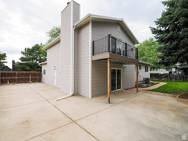 9971 S Borg Dr, Sandy, UT 84092 - back of house with a patio area, a balcony, and a chimney