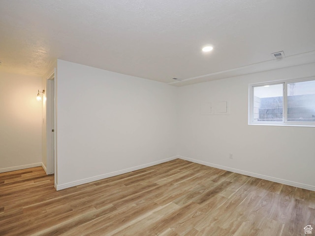 9971 S Borg Dr, Sandy, UT 84092 - empty room featuring light wood-type flooring and recessed lighting