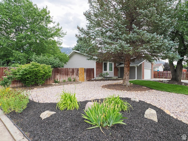 9971 S Borg Dr, Sandy, UT 84092 - view of front of home with an attached garage and brick siding