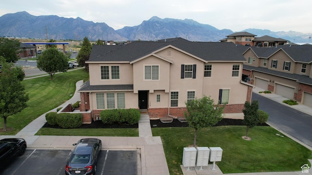 144 W 3430 N, Lehi, UT 84043 - view of front of house with stucco siding, uncovered parking, a mountain view, brick siding, and a front lawn