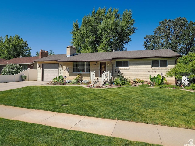 1602 S 550 W, Woods Cross, UT 84087 - ranch-style home featuring an attached garage, concrete driveway, a chimney, and brick siding