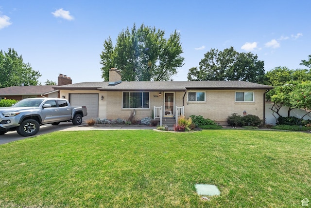1602 S 550 W, Woods Cross, UT 84087 - single story home featuring a garage, a front lawn, concrete driveway, brick siding, and a chimney
