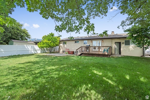 1602 S 550 W, Woods Cross, UT 84087 - rear view of property featuring a wooden deck, a chimney, and a patio