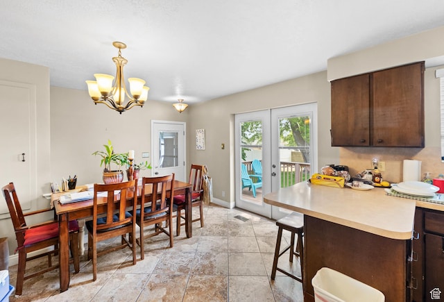 1602 S 550 W, Woods Cross, UT 84087 - dining space with a chandelier, french doors, and light stone finish flooring