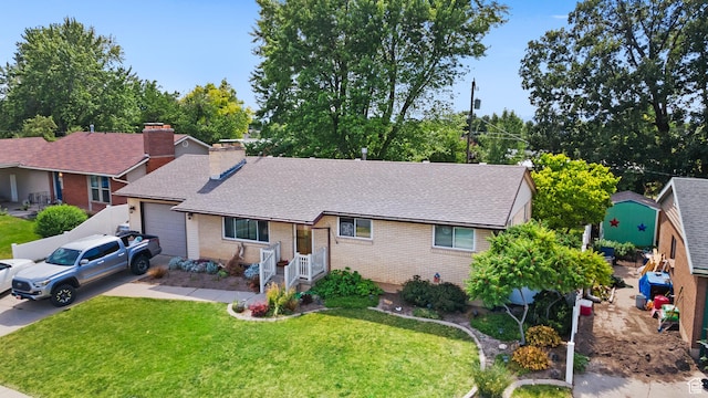 1602 S 550 W, Woods Cross, UT 84087 - ranch-style home with an attached garage, brick siding, a front lawn, and a chimney