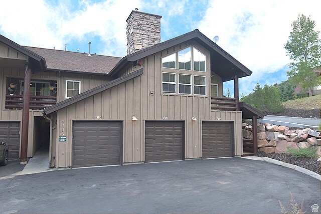 5133 N Cove Canyon Dr Unit 200, Park City, UT 84098 - garage featuring asphalt driveway