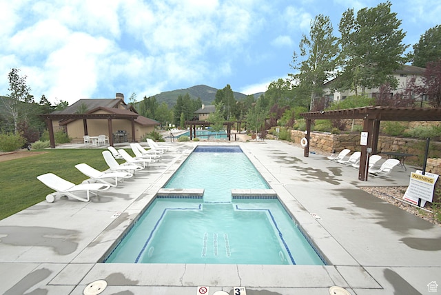 5133 N Cove Canyon Dr Unit 200, Park City, UT 84098 - view of swimming pool featuring a gazebo, a pergola, a mountain view, a patio area, and a pool with connected hot tub