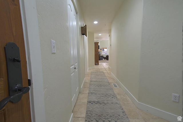 5133 N Cove Canyon Dr Unit 200, Park City, UT 84098 - corridor featuring a textured wall and recessed lighting