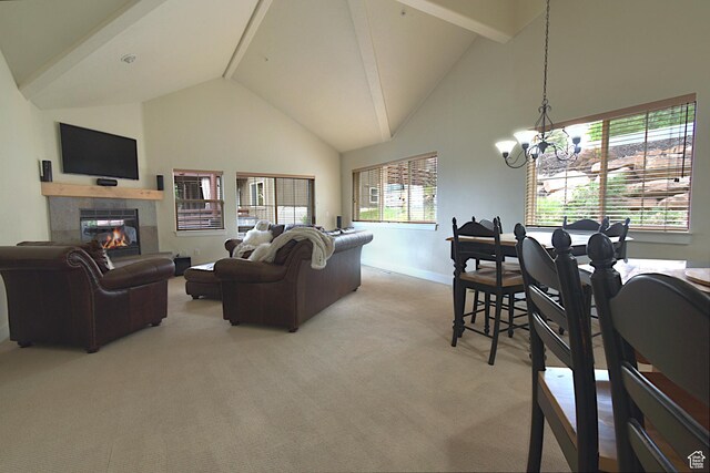 5133 N Cove Canyon Dr Unit 200, Park City, UT 84098 - living room featuring high vaulted ceiling, light colored carpet, a chandelier, a tiled fireplace, and beamed ceiling