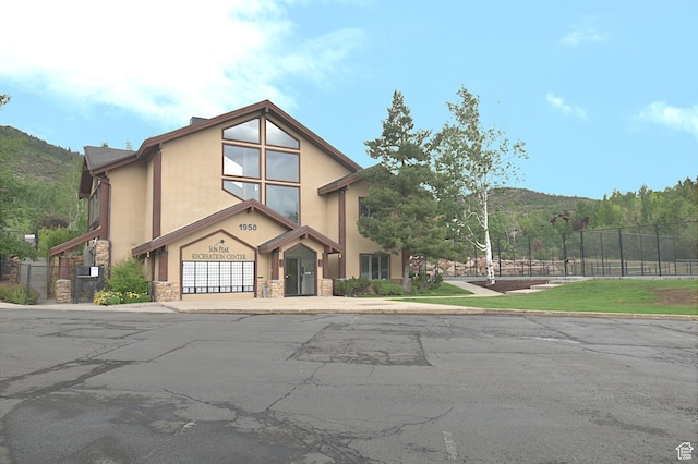 5133 N Cove Canyon Dr Unit 200, Park City, UT 84098 - view of front of property featuring stone siding, stucco siding, and a garage