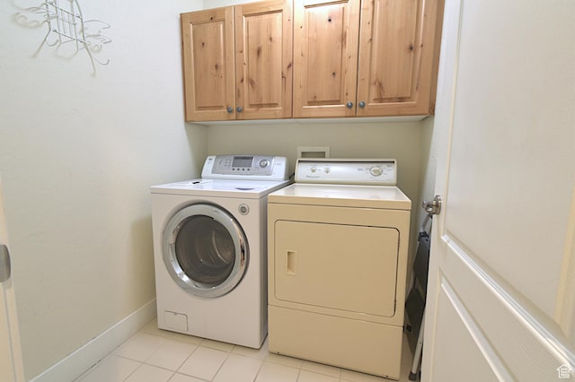 5133 N Cove Canyon Dr Unit 200, Park City, UT 84098 - laundry area featuring washing machine and clothes dryer, cabinet space, and light tile patterned flooring