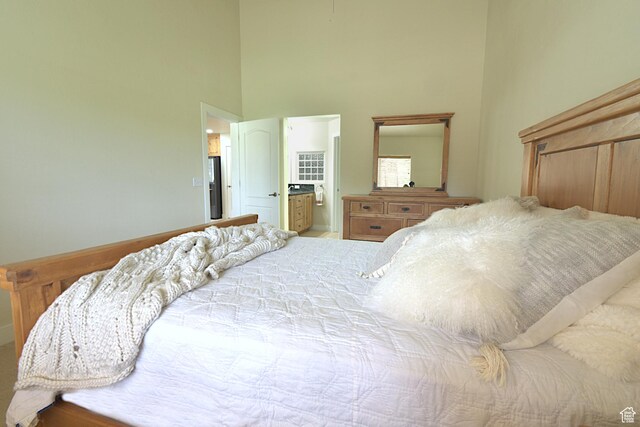 5133 N Cove Canyon Dr Unit 200, Park City, UT 84098 - bedroom featuring a high ceiling, refrigerator with ice dispenser, and connected bathroom