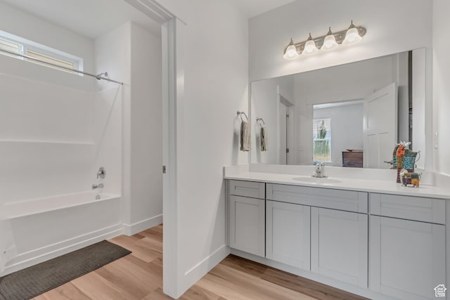 1382 N 3650 W Unit V101, Lehi, UT 84043 - bathroom featuring vanity, wood finished floors, and shower / bathtub combination