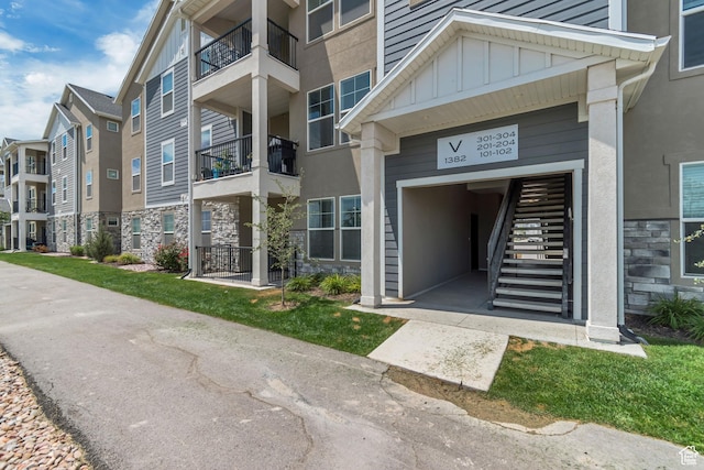 1382 N 3650 W Unit V101, Lehi, UT 84043 - view of building exterior featuring a garage