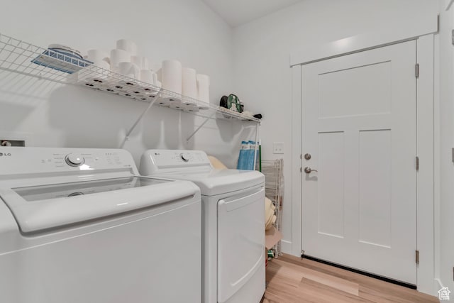 1382 N 3650 W Unit V101, Lehi, UT 84043 - laundry room with washing machine and clothes dryer and light wood-type flooring