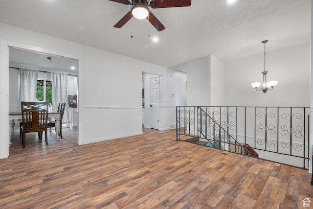 3305 W Kingsbrook Ave S Unit 148, Taylorsville, UT 84129 - empty room featuring wood finished floors, a chandelier, a ceiling fan, and recessed lighting