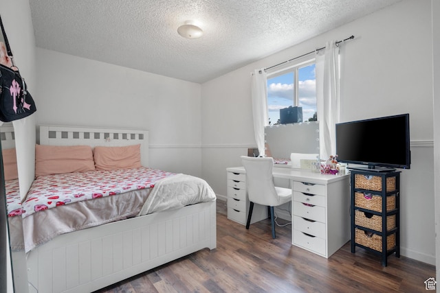 3305 W Kingsbrook Ave S Unit 148, Taylorsville, UT 84129 - bedroom featuring a textured ceiling and wood finished floors