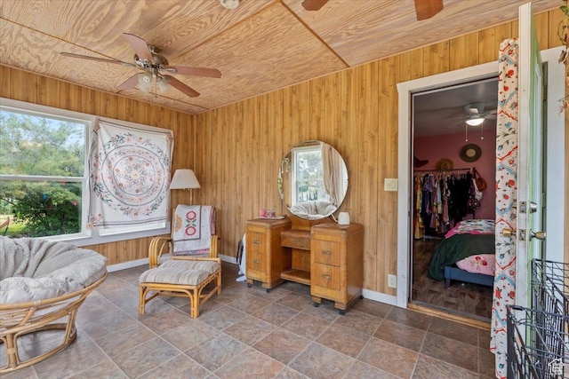 670 E 400 S, Payson, UT 84651 - living area with a ceiling fan, wooden ceiling, wooden walls, and stone finish floors