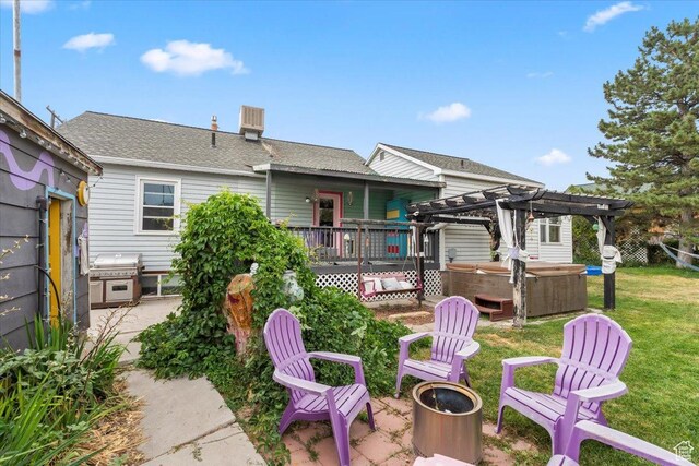 670 E 400 S, Payson, UT 84651 - rear view of property featuring a hot tub, a patio, an outdoor fire pit, a pergola, and a yard