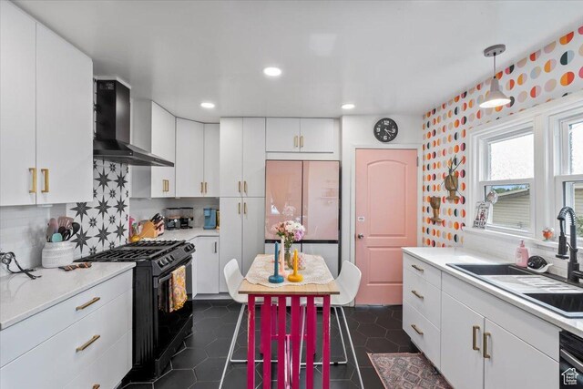 670 E 400 S, Payson, UT 84651 - kitchen featuring wall chimney exhaust hood, black gas range oven, fridge, light countertops, and recessed lighting