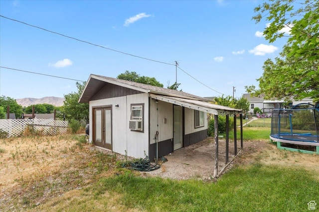 670 E 400 S, Payson, UT 84651 - view of property exterior with a trampoline, a mountain view, and an outbuilding