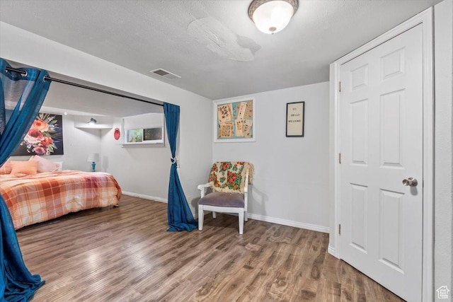 670 E 400 S, Payson, UT 84651 - bedroom with wood finished floors and a textured ceiling