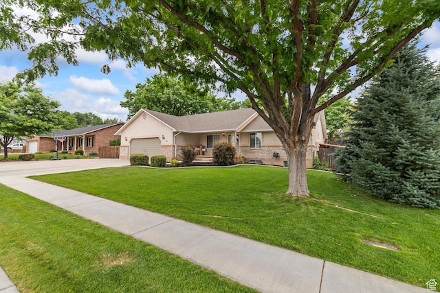 528 W 650 S, Richfield, UT 84701 - single story home featuring driveway, an attached garage, a front lawn, stucco siding, and brick siding