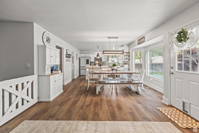 528 W 650 S, Richfield, UT 84701 - dining space featuring dark wood-type flooring and a textured ceiling