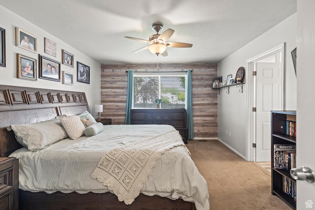 528 W 650 S, Richfield, UT 84701 - bedroom featuring carpet floors, wooden walls, a ceiling fan, and an accent wall