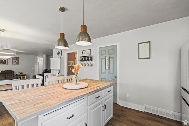 528 W 650 S, Richfield, UT 84701 - kitchen with butcher block counters, open floor plan, white cabinetry, dark wood-style floors, and decorative light fixtures