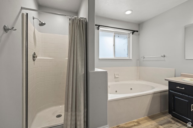 528 W 650 S, Richfield, UT 84701 - full bath featuring vanity, a tub with jets, a shower stall, and wood finished floors