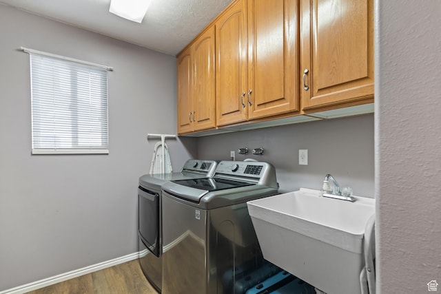 528 W 650 S, Richfield, UT 84701 - laundry area with separate washer and dryer, cabinet space, and wood finished floors