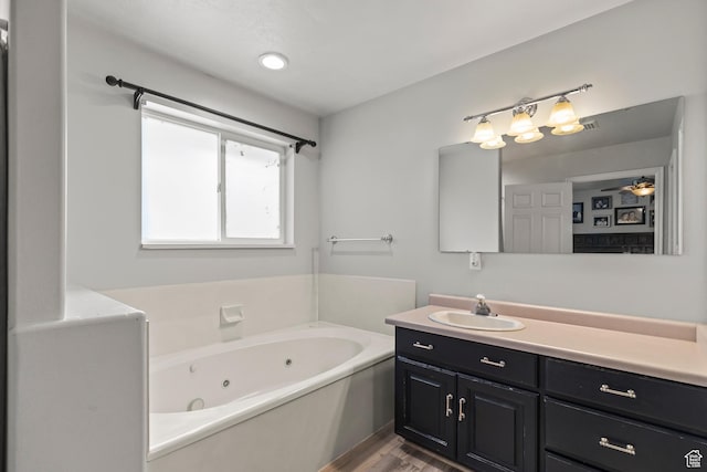 528 W 650 S, Richfield, UT 84701 - full bathroom with vanity, a whirlpool tub, and wood finished floors