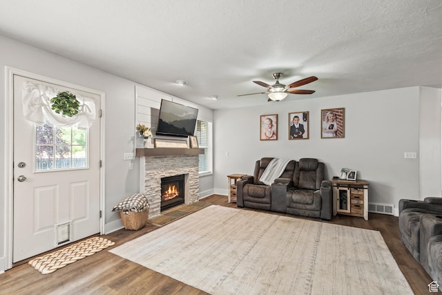 528 W 650 S, Richfield, UT 84701 - living area with a ceiling fan, wood finished floors, and a stone fireplace