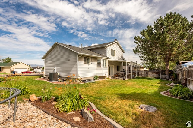 576 Mayo Dr N, Tooele, UT 84074 - rear view of property with a patio area and roof with shingles