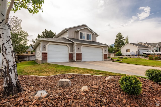 576 Mayo Dr N, Tooele, UT 84074 - view of front facade featuring brick siding, concrete driveway, and an attached garage