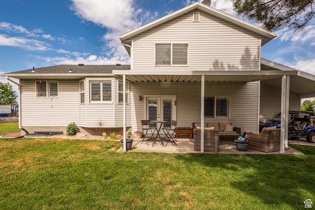576 Mayo Dr N, Tooele, UT 84074 - back of property with french doors, an outdoor hangout area, a yard, and a patio