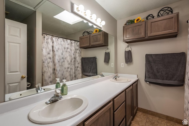 576 Mayo Dr N, Tooele, UT 84074 - bathroom with double vanity, tile patterned floors, and a shower with curtain