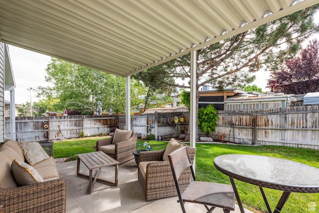576 Mayo Dr N, Tooele, UT 84074 - fenced backyard featuring an outdoor living space and a patio area