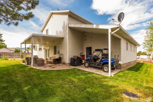 576 Mayo Dr N, Tooele, UT 84074 - back of house with an outdoor hangout area and a carport