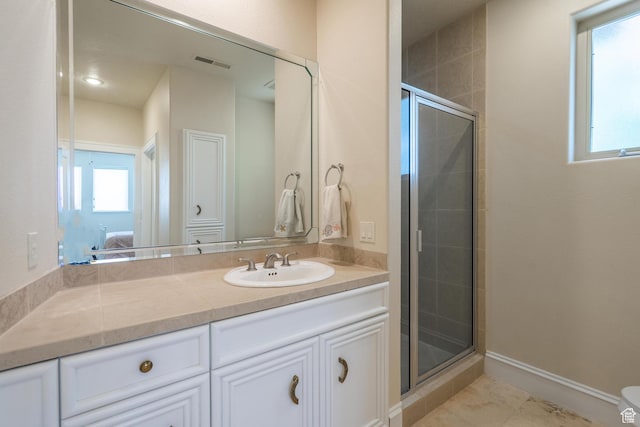 16 N Lions Head Cir, Washington, UT 84780 - bathroom with ensuite bathroom, vanity, and a stall shower