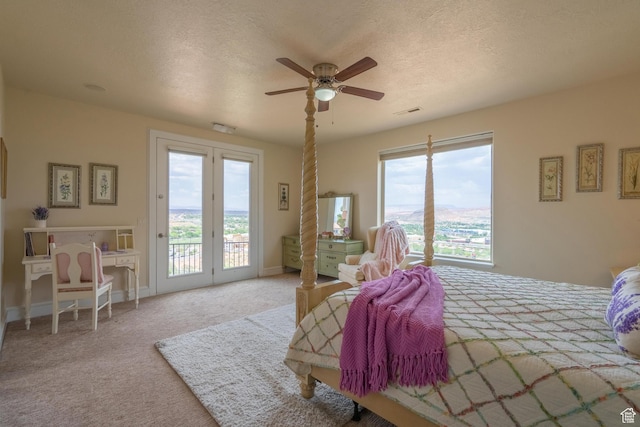 16 N Lions Head Cir, Washington, UT 84780 - bedroom featuring access to outside, carpet flooring, ceiling fan, and a textured ceiling