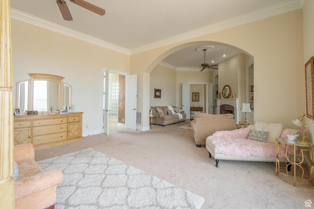 16 N Lions Head Cir, Washington, UT 84780 - carpeted bedroom with ornamental molding, arched walkways, a fireplace, and a ceiling fan