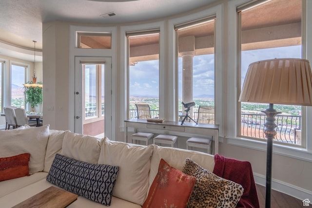16 N Lions Head Cir, Washington, UT 84780 - living room featuring wood finished floors and baseboards