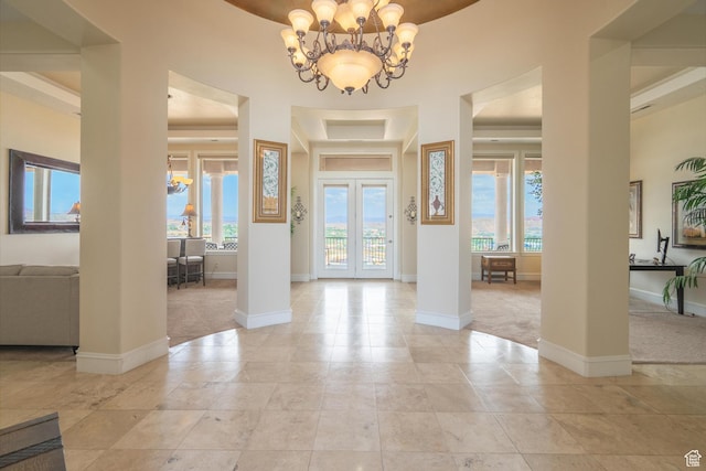16 N Lions Head Cir, Washington, UT 84780 - entrance foyer featuring healthy amount of natural light, light colored carpet, and a chandelier