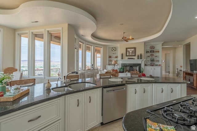 16 N Lions Head Cir, Washington, UT 84780 - kitchen with dishwasher, open floor plan, a fireplace, a ceiling fan, and built in features
