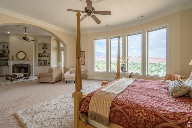 16 N Lions Head Cir, Washington, UT 84780 - bedroom featuring multiple windows, light colored carpet, crown molding, and arched walkways
