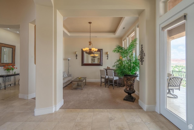 16 N Lions Head Cir, Washington, UT 84780 - entryway with a chandelier, light colored carpet, a raised ceiling, and light tile patterned floors