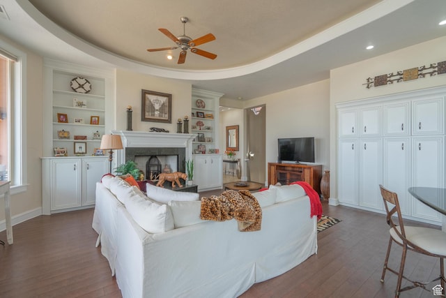 16 N Lions Head Cir, Washington, UT 84780 - living room with a ceiling fan, dark wood finished floors, built in shelves, a fireplace, and recessed lighting