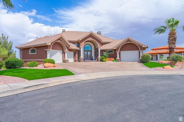 16 N Lions Head Cir, Washington, UT 84780 - mediterranean / spanish-style home with a chimney, stucco siding, a tiled roof, concrete driveway, and an attached garage
